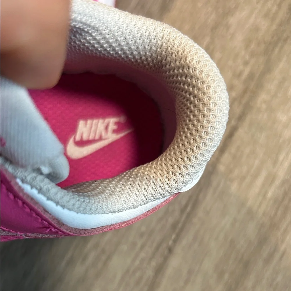 Nike Kids White and Hot Pink Low-Top Sneakers.